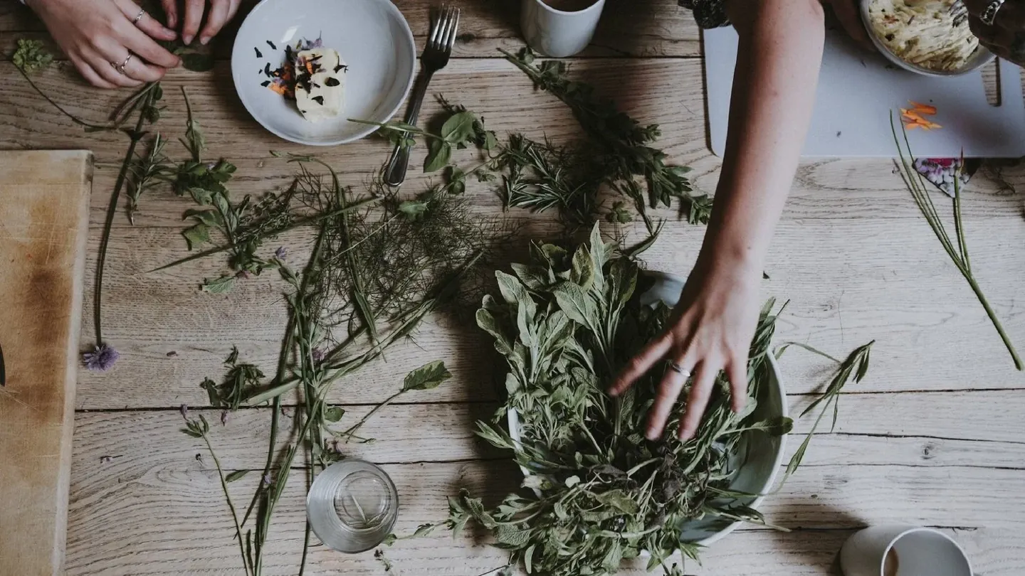 Fresh botanicals arranged on a wooden table