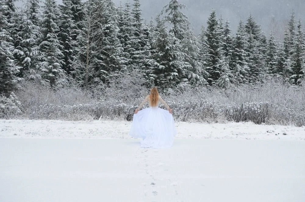 Michele in a snowy landscape in an original winter herbs story